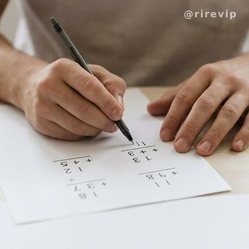 Hands working through arithmetic on paper illustrating common reasoning errors